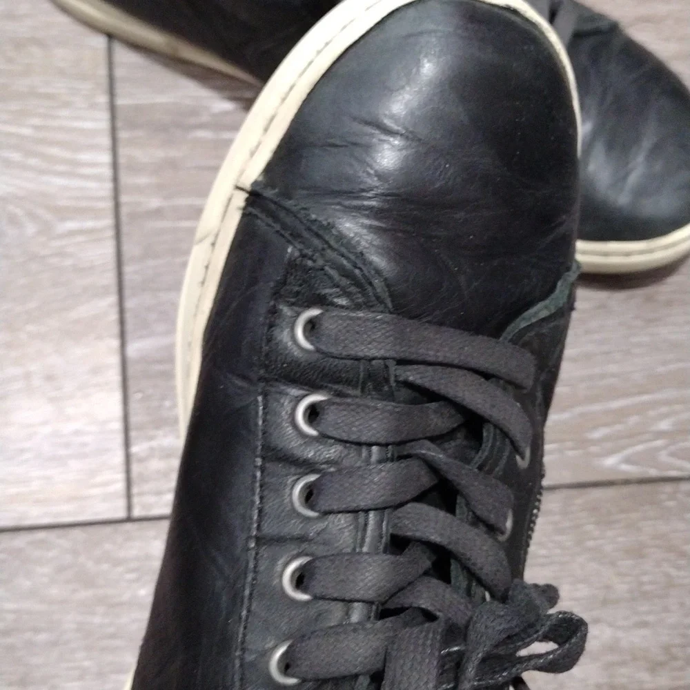 UGG womens black leather zip or lace high top sneakers. Size 8
